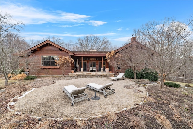 back of house with a patio area