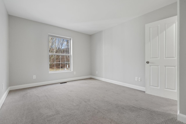 spare room featuring carpet floors