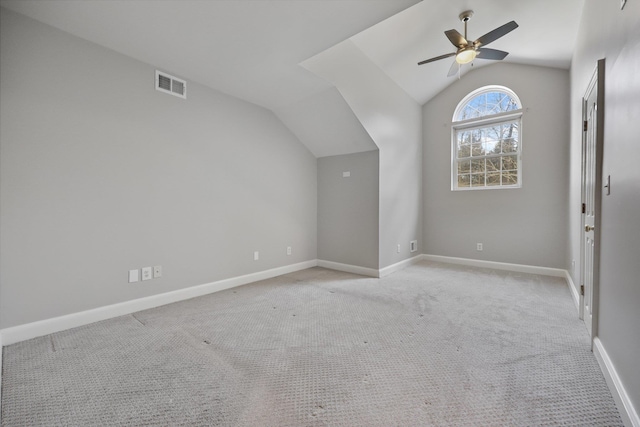 bonus room featuring lofted ceiling, light colored carpet, and ceiling fan