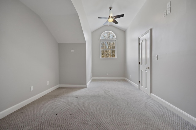 bonus room featuring ceiling fan, light carpet, and vaulted ceiling