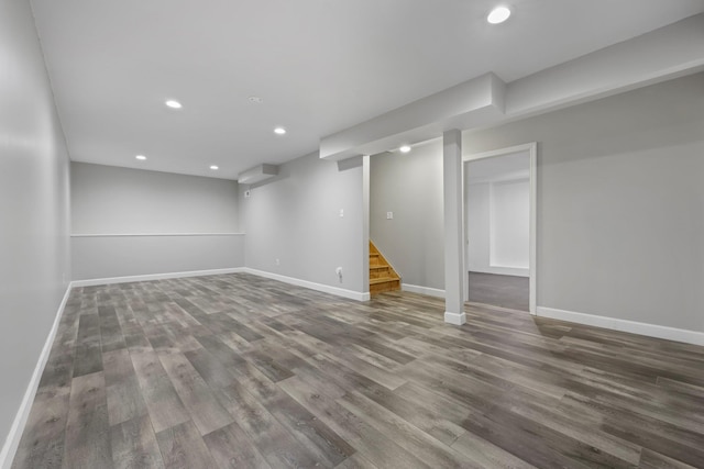 basement with hardwood / wood-style flooring