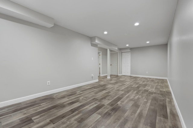 basement with hardwood / wood-style flooring