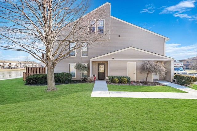 view of front of property with a garage and a front yard