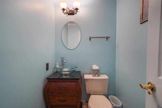 bathroom featuring toilet and vanity