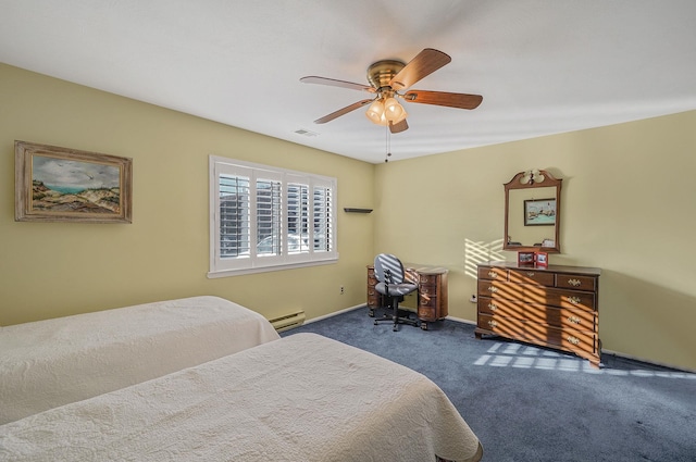 carpeted bedroom featuring a baseboard heating unit and ceiling fan