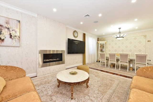 living room featuring hardwood / wood-style flooring and ornamental molding