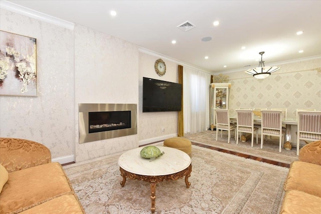 living room featuring ornamental molding and hardwood / wood-style floors