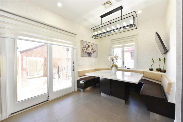 dining area featuring breakfast area and a healthy amount of sunlight