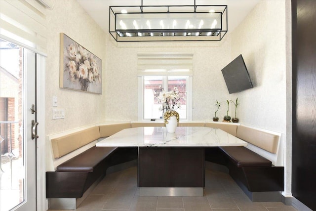 tiled dining space with a wealth of natural light and breakfast area