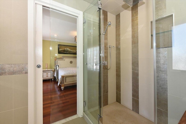 bathroom with crown molding and walk in shower