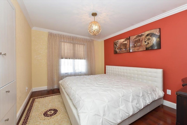 bedroom featuring crown molding and dark hardwood / wood-style flooring