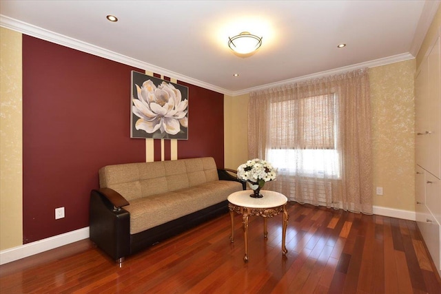 sitting room featuring wood-type flooring and ornamental molding