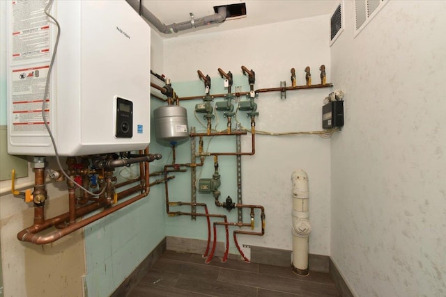 utility room with tankless water heater