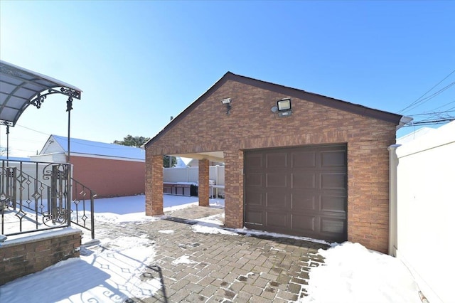 view of snow covered garage