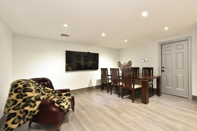 dining space with light hardwood / wood-style flooring