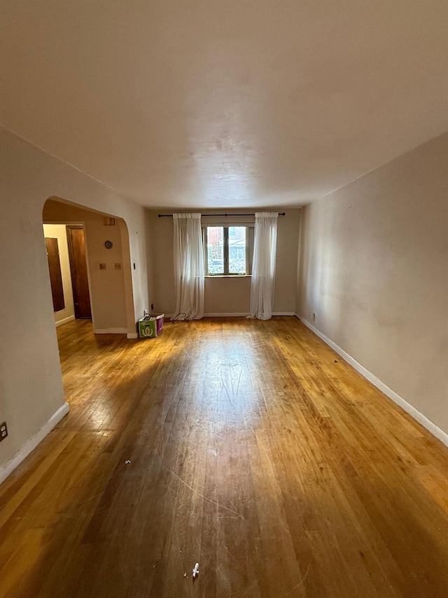 empty room with hardwood / wood-style floors