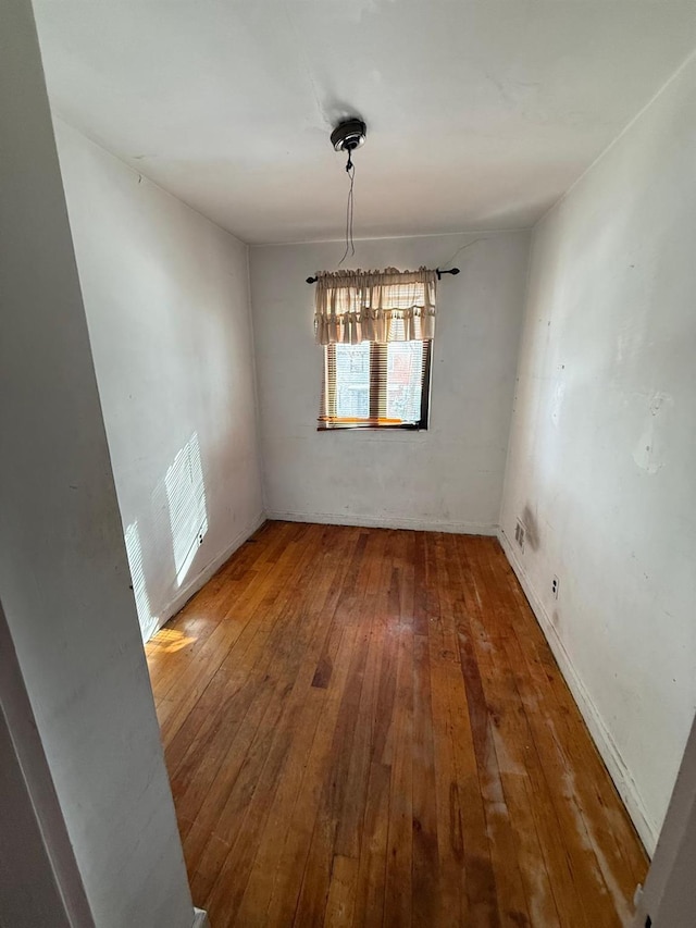 unfurnished dining area with hardwood / wood-style floors