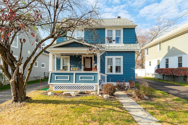 view of front of home featuring a porch and a front yard