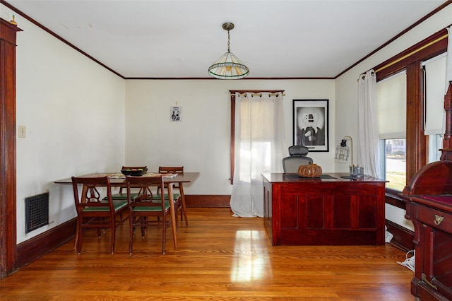 dining area with light hardwood / wood-style flooring