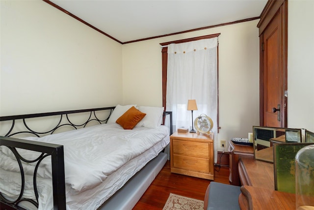 bedroom with dark hardwood / wood-style floors