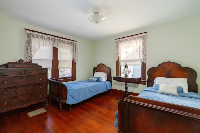 bedroom featuring dark wood-type flooring