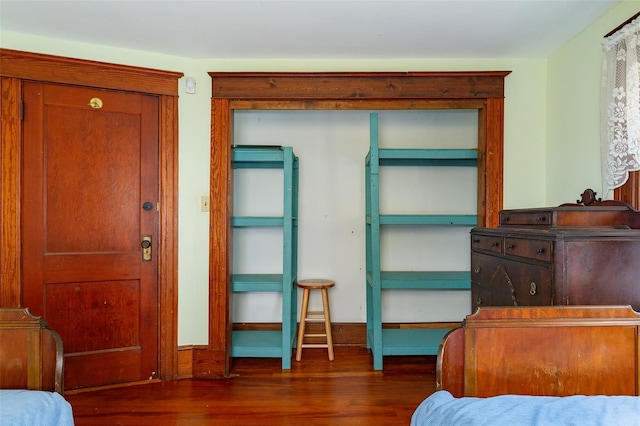 bedroom featuring dark wood-type flooring