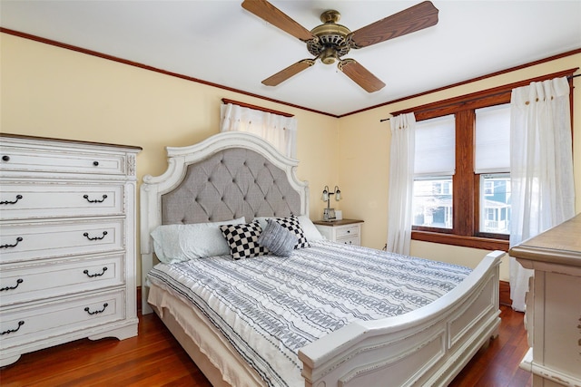 bedroom featuring ceiling fan, crown molding, and dark hardwood / wood-style floors
