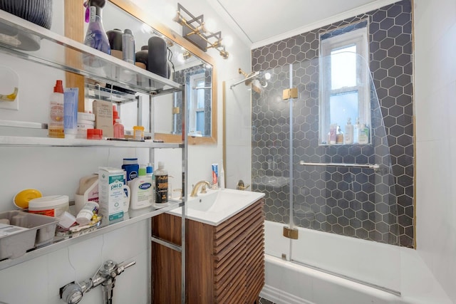 bathroom featuring vanity, crown molding, and enclosed tub / shower combo