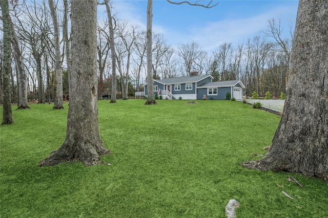 view of yard featuring a garage