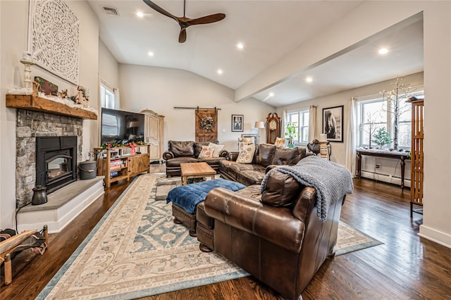 living room featuring dark wood-type flooring, vaulted ceiling, a baseboard radiator, a barn door, and ceiling fan