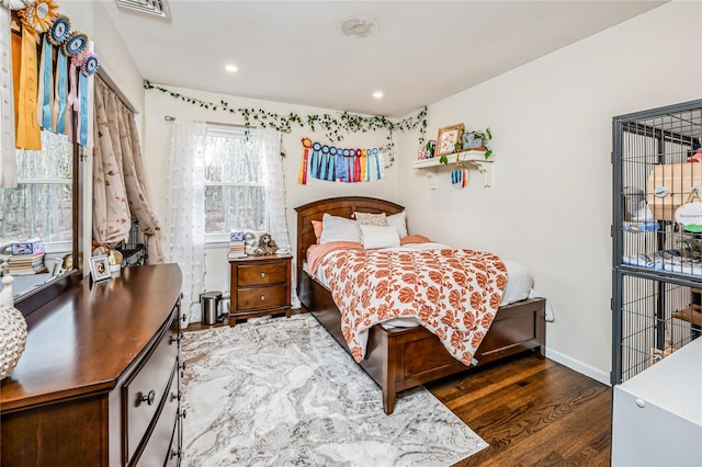 bedroom featuring dark hardwood / wood-style flooring