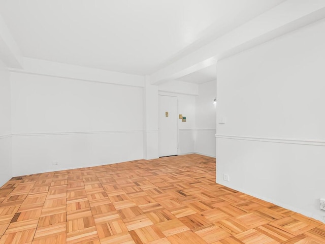 spare room with light parquet flooring