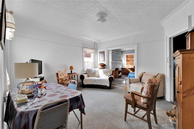 living room featuring light carpet, a textured ceiling, and ornamental molding