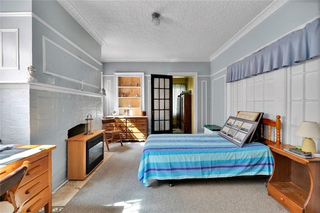 bedroom featuring a textured ceiling and ornamental molding