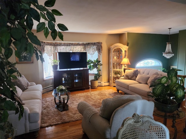 living room with baseboard heating and hardwood / wood-style floors