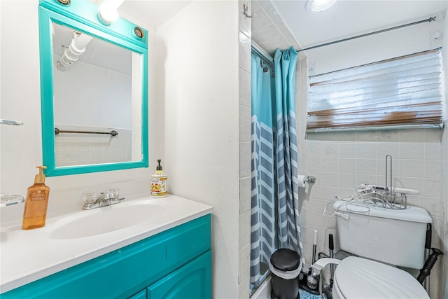 bathroom with a shower with curtain, toilet, tile walls, and vanity