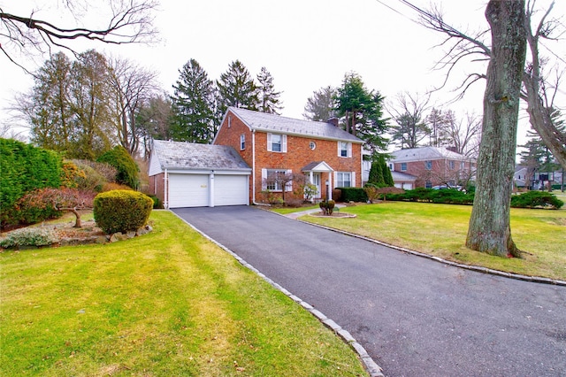 view of front of home with a garage and a front yard