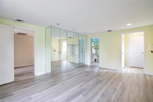 empty room featuring light hardwood / wood-style floors