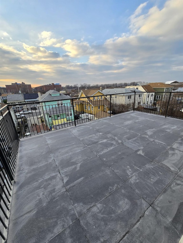 view of patio terrace at dusk