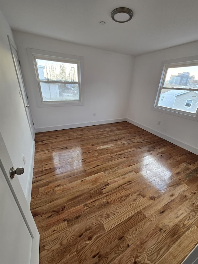 spare room featuring hardwood / wood-style flooring