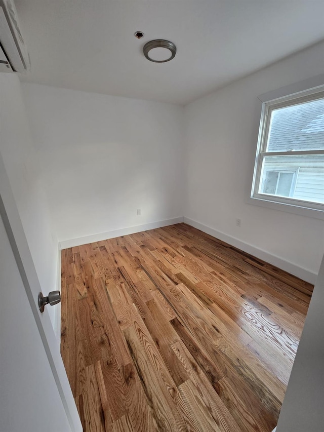 spare room featuring light hardwood / wood-style floors