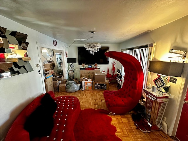 living room featuring an inviting chandelier and parquet flooring