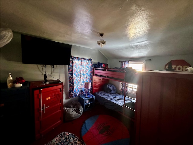 bedroom featuring vaulted ceiling