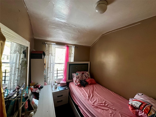 bedroom with lofted ceiling