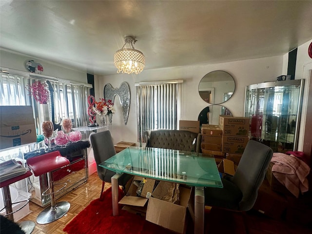 dining area with an inviting chandelier