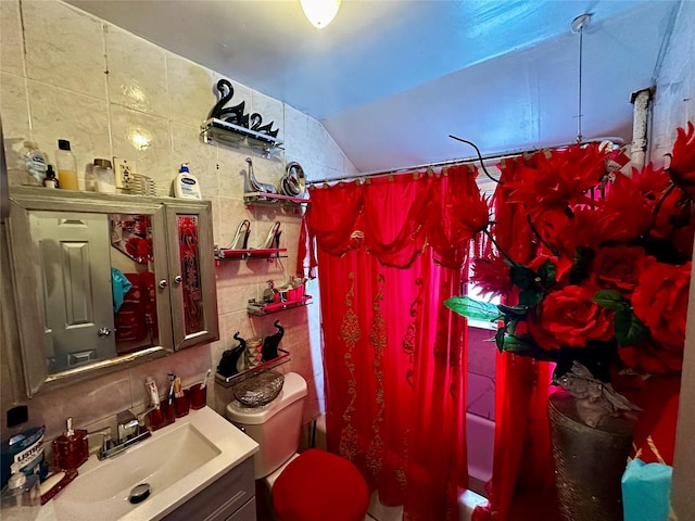 bathroom with toilet, vanity, tile walls, shower / tub combo with curtain, and tasteful backsplash