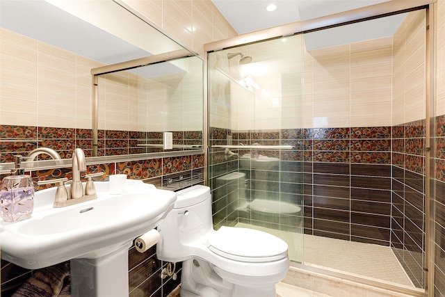 bathroom with sink, toilet, tile walls, and walk in shower