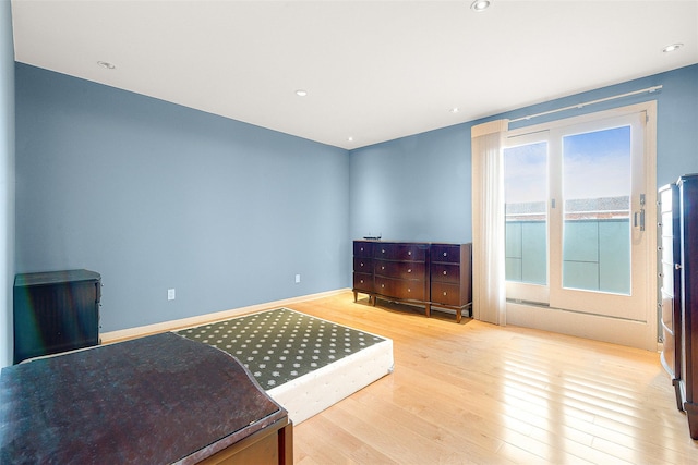 bedroom with light hardwood / wood-style floors