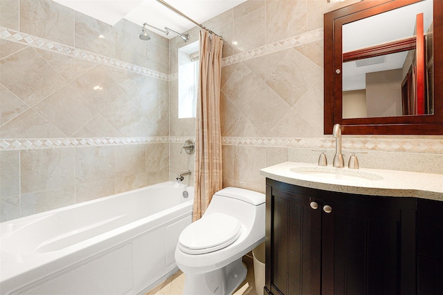 full bathroom featuring shower / bath combo, vanity, toilet, and tile walls