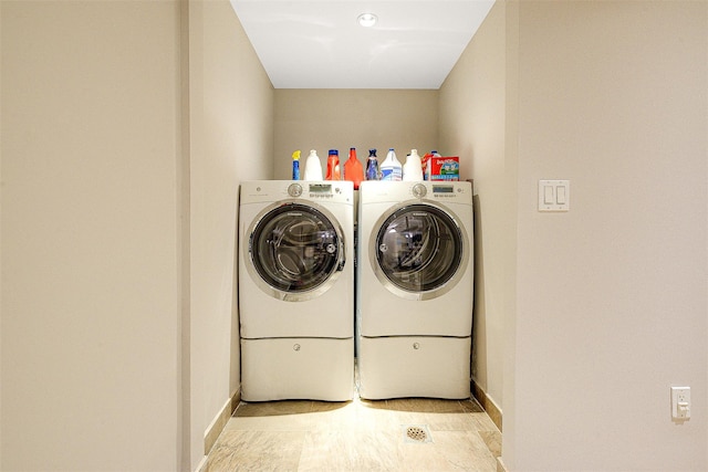 washroom with washing machine and dryer